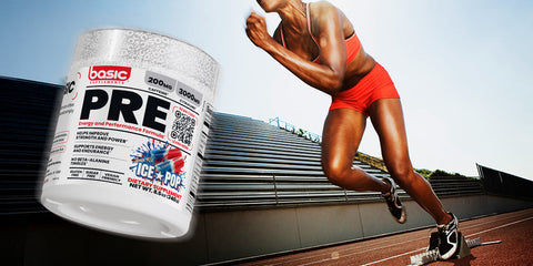 A container of Basic Supplements Ice Pop Pre-Workout is shown next to a sprinter launching off the starting blocks on an outdoor track, suggesting enhanced energy and performance.