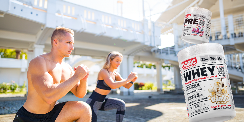  A man and woman exercising outdoors with whey protein and pre-workout supplement containers in the foreground.